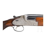 A Merkel 203 over-and-under shotgun with interchangeable over-and-under shotgun barrel and rifle barrel, with Schmidt & Bender scope