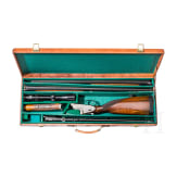 A Merkel 203 over-and-under shotgun with interchangeable over-and-under shotgun barrel and rifle barrel, with Schmidt & Bender scope