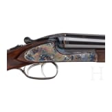 A Merkel side-by-side double rifle with Meopta scope and interchangeable side-by-side shotgun barrel