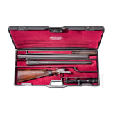 A Merkel side-by-side double rifle with Meopta scope and interchangeable side-by-side shotgun barrel