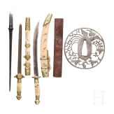 A Tsuba, a Kozuka, an arrowhead and two miniature swords, Japan, Edo period