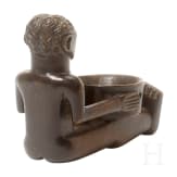 A wooden sculpture of a sitting boy holding a bowl, Luba, Congo