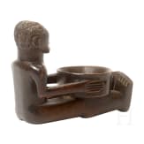 A wooden sculpture of a sitting boy holding a bowl, Luba, Congo