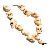 A Tibetan skull necklace, circa 1900