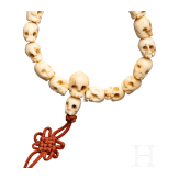 A Tibetan skull necklace, circa 1900