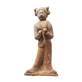 A ceramic figurine of a standing lady, China, Tang period
