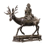A bronze sculpture of a deer with a wise man, China, 18th century
