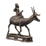 A bronze sculpture of a deer with a wise man, China, 18th century
