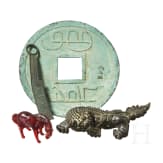 Four antique Chinese objects, horse, guardian lion, coins
