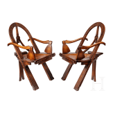 Two carved armchairs in Russian style "bow, axes and mittens", after the well-known model of carver Vasiliy Shutov, Russia, circa 1900