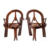 Two carved armchairs in Russian style "bow, axes and mittens", after the well-known model of carver Vasiliy Shutov, Russia, circa 1900