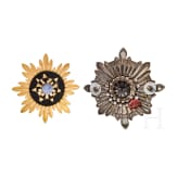 Two German helmet emblems