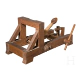 A detailed model of a catapult, circa 1900