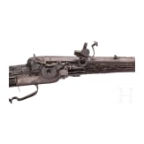 A southern German carved wheellock rifle with mother-of-pearl inlays in the style of the Maucher family of Schw&auml;bisch-Gm&uuml;nd, late 17th century