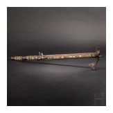 A Silesian battle axe with integrated flintlock and dagger, circa 1700