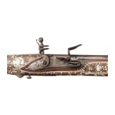 A Silesian battle axe with integrated flintlock and dagger, circa 1700