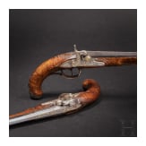 A fine pair of southern German percussion pistols with chiseled mounts, circa 1780