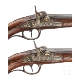 A fine pair of southern German percussion pistols with chiseled mounts, circa 1780