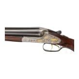 A Merkel double-rifle with Zeiss scope, and a side-by-side shotgun barrel set with case