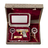 A cased Norinco M 84 in gold finish
