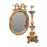 A fine German carved and original Louis XVI mirror with Baroque altar candle stick, 18th century