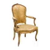 A carved and gilded French Louis XV fauteuil, 18th century