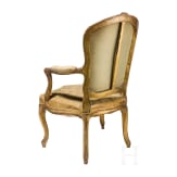 A carved and gilded French Louis XV fauteuil, 18th century