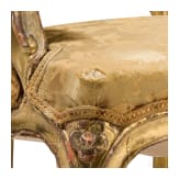 A carved and gilded French Louis XV fauteuil, 18th century