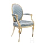 A carved Swedish/Scandinavian neoclassical fauteuil, painted white and partly gilded, early 19th century
