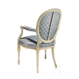 A carved Swedish/Scandinavian neoclassical fauteuil, painted white and partly gilded, early 19th century