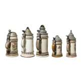 Five motif jugs with tin lids, around 1900
