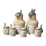 Two Mettlach historicism lidded cans and four drinking mugs with figure frieze, end of 19th century