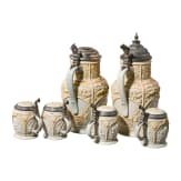 Two Mettlach historicism lidded cans and four drinking mugs with figure frieze, end of 19th century
