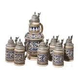A lidded can with six beer mugs, short before 1900