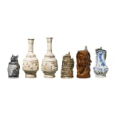 A beer mug, three pitchers and two vases