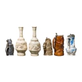 A beer mug, three pitchers and two vases