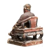 A Chinese carved and painted sculpture of a sitting scholar, 18th century