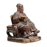 A Chinese carved and painted sculpture of a sitting scholar, 18th century