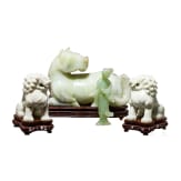 A pair of Chinese lions, a nephrite horse and a nephrite statuette, 20th century