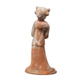 A ceramic figurine of a standing lady, China, Tang period