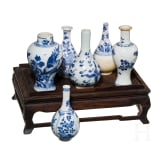 A set of six Chinese miniature vases on a stand, 18th/19th century