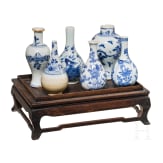 A set of six Chinese miniature vases on a stand, 18th/19th century