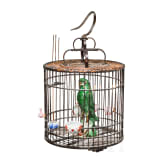 A large Chinese songbird cage, circa 1900, with shells and fayance sculpture of an ara