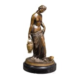 A bronze figure of a nymph fetching water, signed "J.G. Rau"