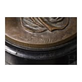 A bronze figure of a nymph fetching water, signed "J.G. Rau"