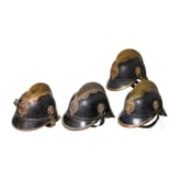 Vier Helme Feuerl&ouml;schwesen (Freiwillige Feuerwehr), Deutschland / USA, um 1900