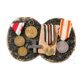 A collection of medals, insignias, documents, 19th/20th century