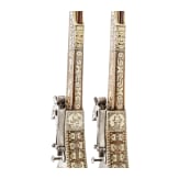 A pair of long wheellock pistols by Peter Danner, Nuremberg, dated 1587, with bone-inlaid stocks of later date