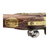 A splendid fire-gilt flintlock pistol by Jean Brion &agrave; Paris, circa 1710