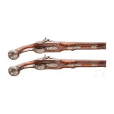 A pair of double-barreled percussion pistols with profuse chiselling, G. A. Moritz in Zella St. Blasii, circa 1820/30